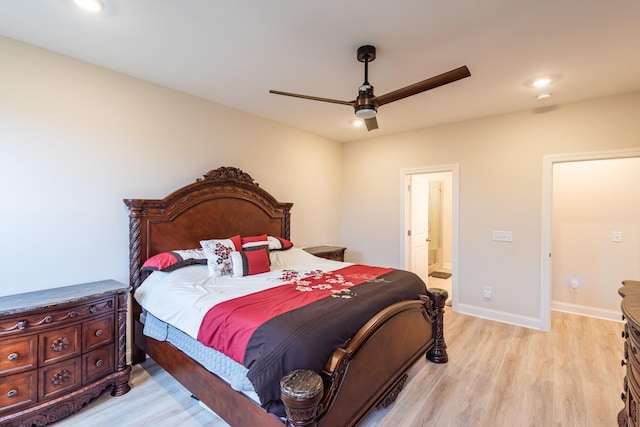 bedroom with ceiling fan, light hardwood / wood-style floors, and connected bathroom