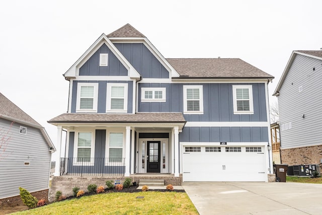 craftsman-style home featuring a garage and a front yard