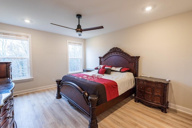 bedroom featuring light wood-type flooring and ceiling fan