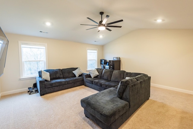 carpeted living room with vaulted ceiling and ceiling fan