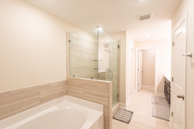 bathroom featuring separate shower and tub, tile patterned flooring, and vanity