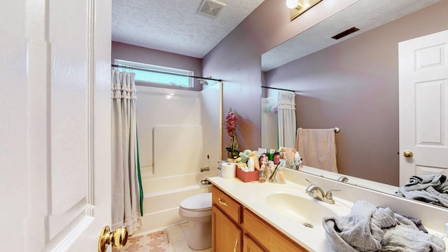 full bathroom featuring shower / tub combo with curtain, toilet, a textured ceiling, vanity, and tile patterned flooring