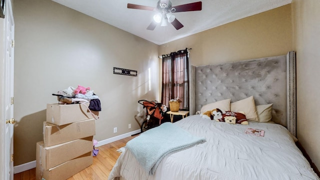 bedroom with ceiling fan and hardwood / wood-style floors