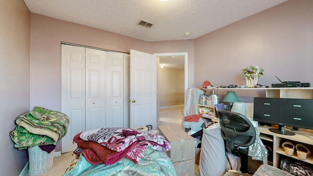 carpeted home office with a textured ceiling