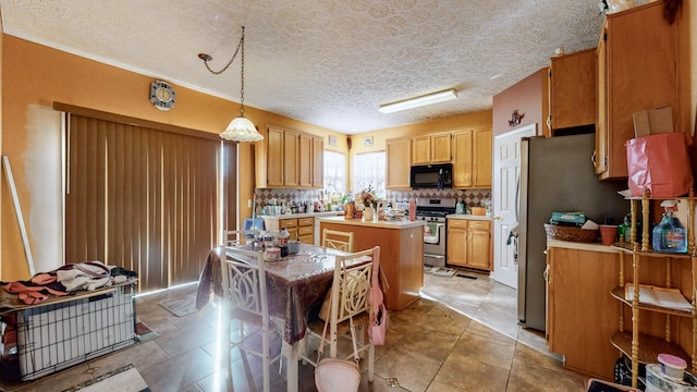 kitchen with pendant lighting, appliances with stainless steel finishes, a kitchen island, a kitchen bar, and decorative backsplash