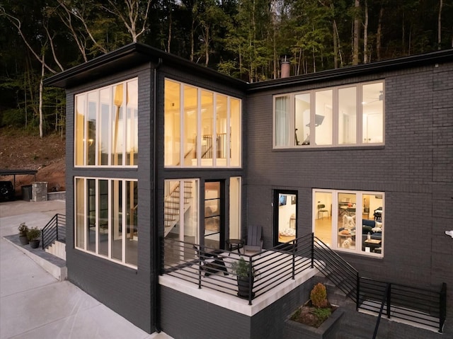 rear view of house with a sunroom