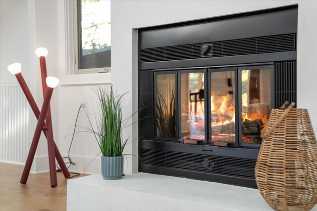 interior details featuring hardwood / wood-style flooring