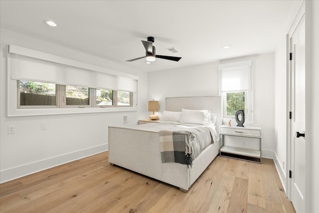 bedroom featuring light wood-type flooring and ceiling fan