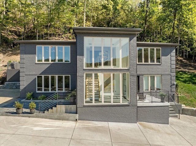 rear view of property featuring a patio area