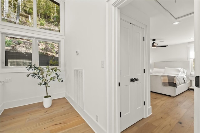 hallway featuring light hardwood / wood-style flooring