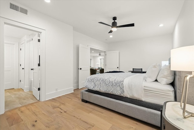 bedroom featuring ceiling fan and light hardwood / wood-style floors