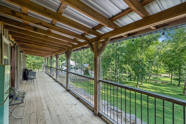 wooden deck featuring a yard