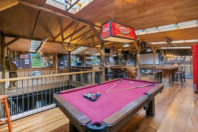 playroom with a skylight, hardwood / wood-style flooring, wooden ceiling, and billiards