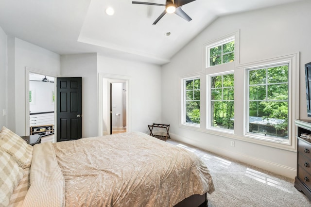 bedroom with connected bathroom, ceiling fan, carpet, and lofted ceiling