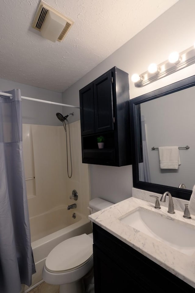 full bathroom featuring vanity, shower / bath combo, toilet, and a textured ceiling