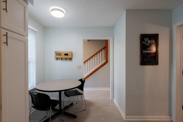 dining space with light wood-type flooring