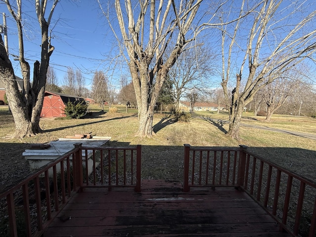 wooden deck featuring an outdoor structure