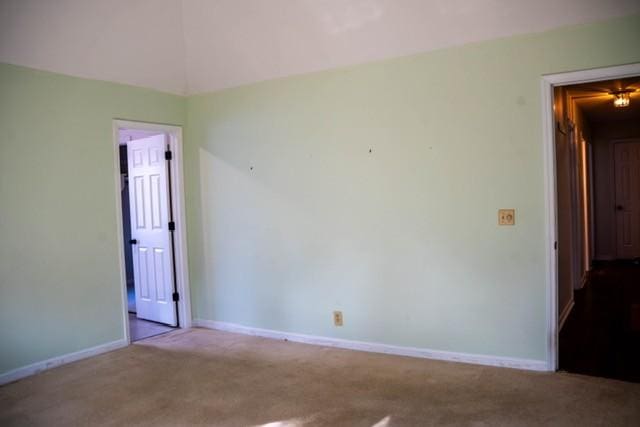 empty room with light colored carpet