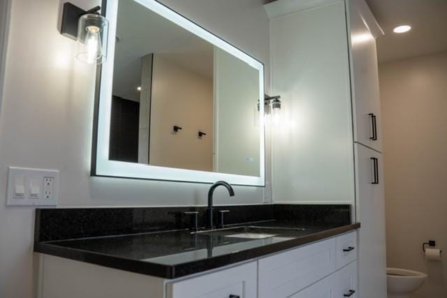 bathroom with vanity and toilet