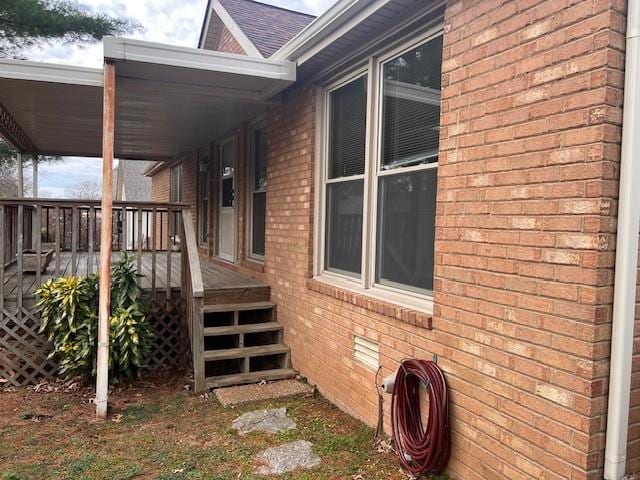 view of home's exterior with a wooden deck