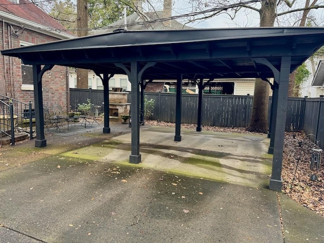 view of vehicle parking with a carport