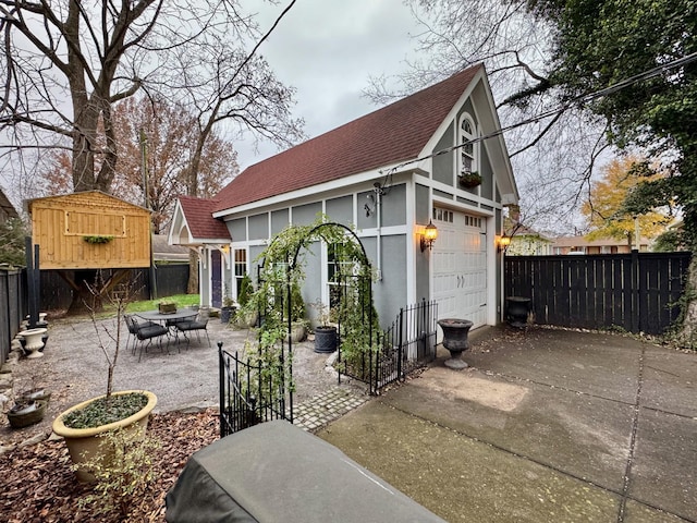 exterior space with an outbuilding and a patio