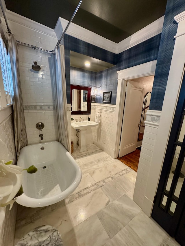 bathroom with ornamental molding and shower / bath combo with shower curtain