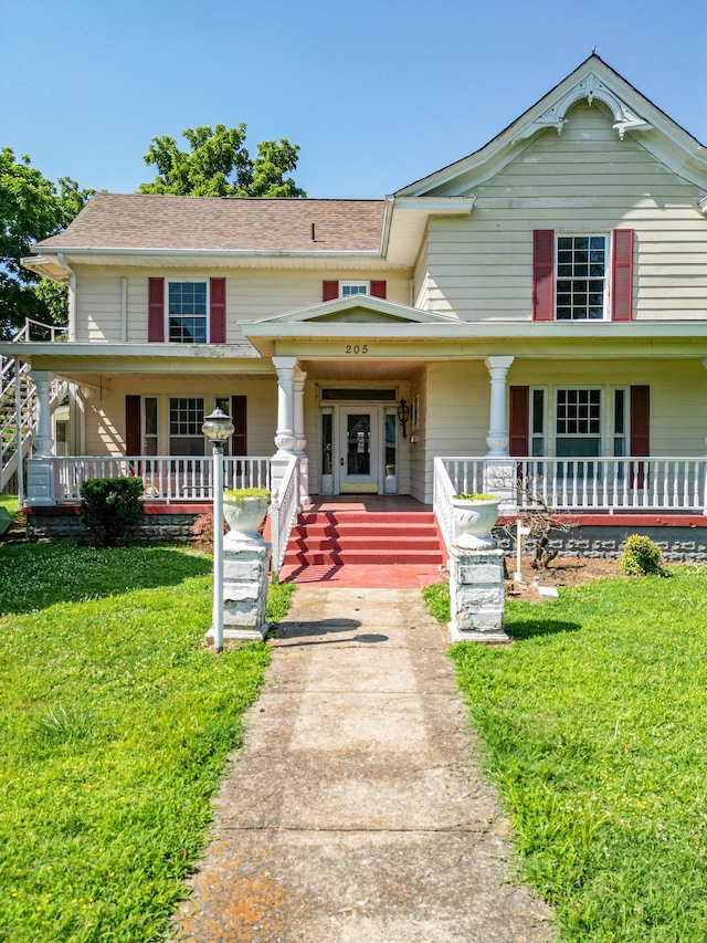 view of front facade with a porch and a front yard