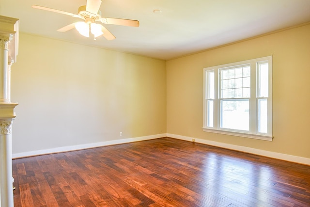 spare room featuring ceiling fan and dark wood-type flooring