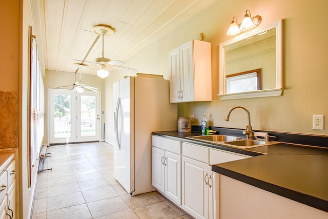 kitchen with white cabinetry, sink, light tile patterned flooring, and french doors