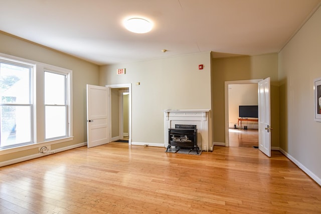 unfurnished living room featuring light hardwood / wood-style flooring