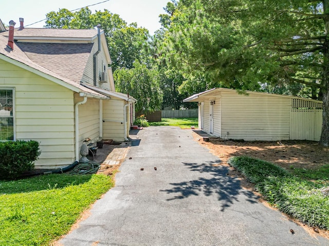 exterior space featuring a shed