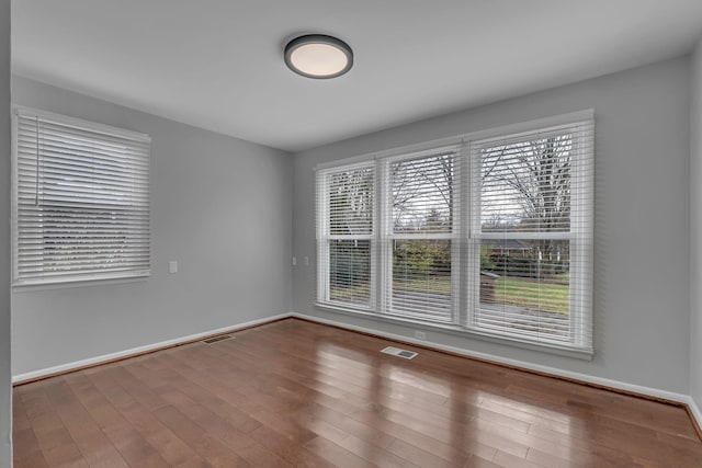 empty room featuring hardwood / wood-style floors