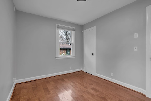 spare room featuring hardwood / wood-style floors