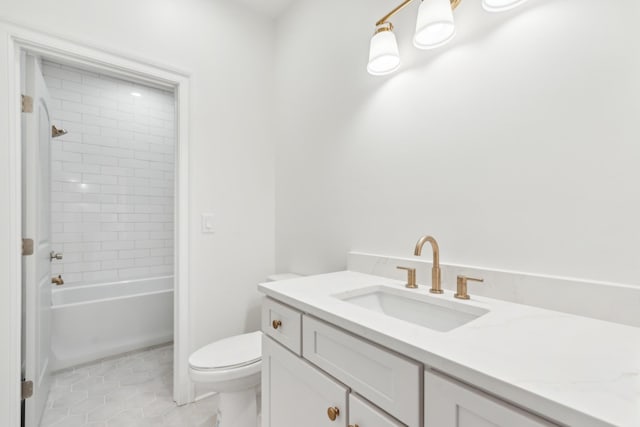 full bathroom featuring tile patterned flooring, vanity, toilet, and tiled shower / bath