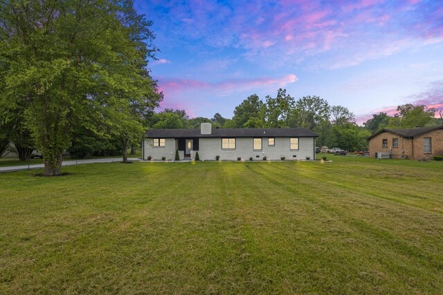 view of front of home featuring a yard