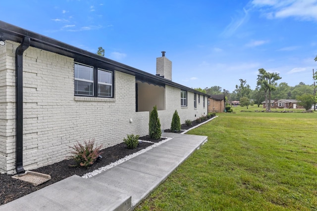 view of property exterior featuring a yard