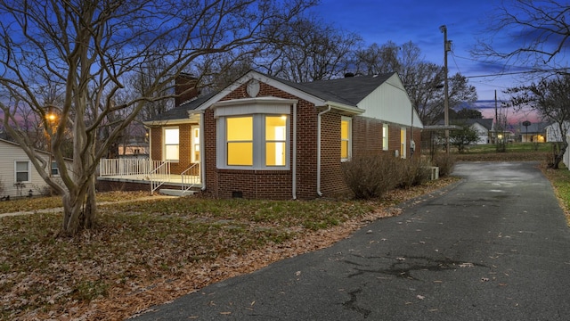 view of property exterior at dusk