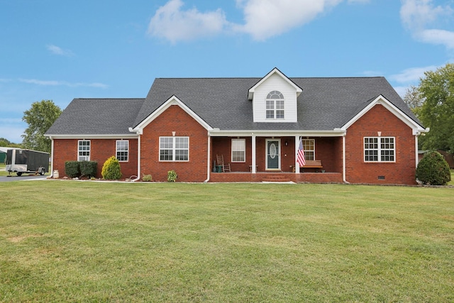 view of front of property with covered porch and a front yard