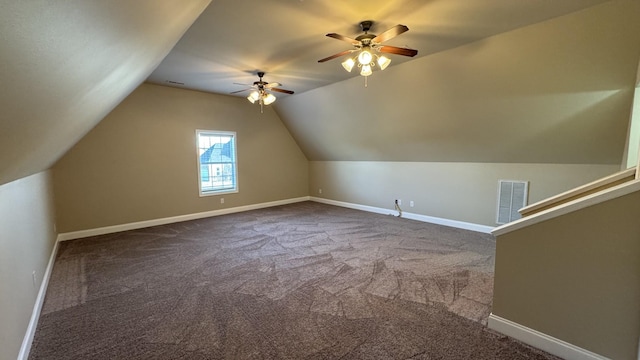 additional living space with ceiling fan, carpet floors, and lofted ceiling