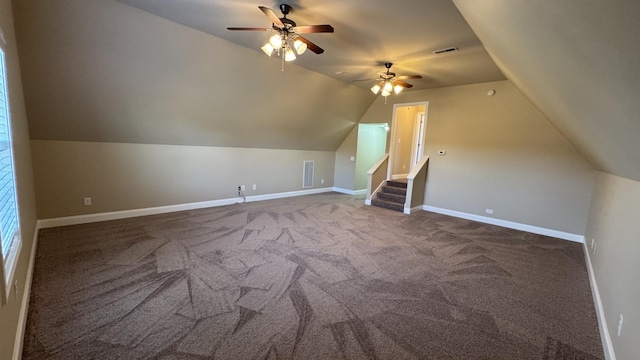 additional living space featuring ceiling fan, carpet floors, and vaulted ceiling