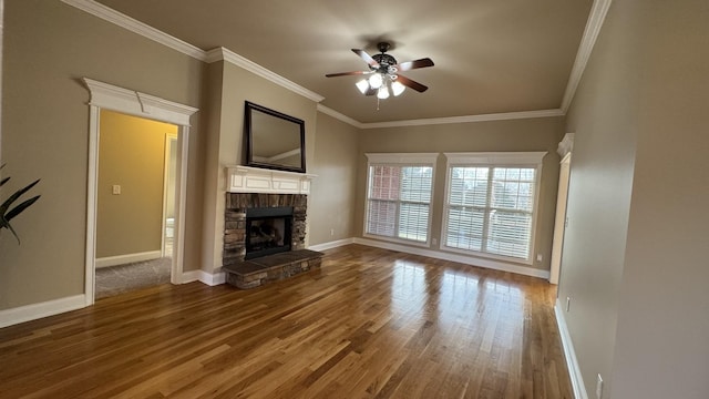 unfurnished living room with a stone fireplace, ceiling fan, hardwood / wood-style flooring, and ornamental molding