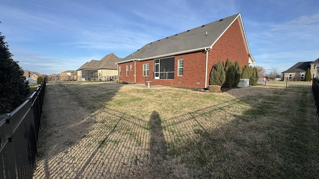 view of home's exterior with a lawn