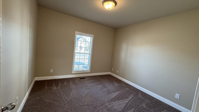 spare room featuring carpet