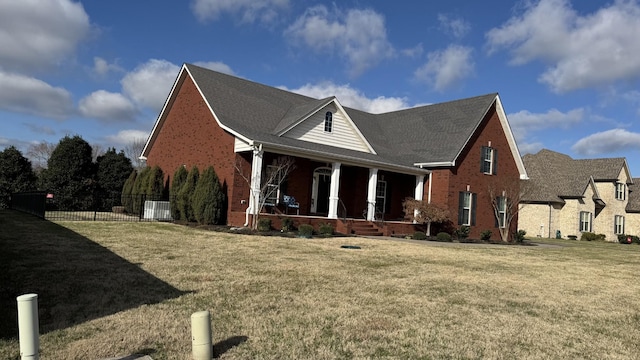 view of home's exterior featuring a lawn and a porch