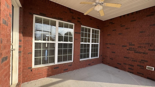 exterior space featuring ceiling fan