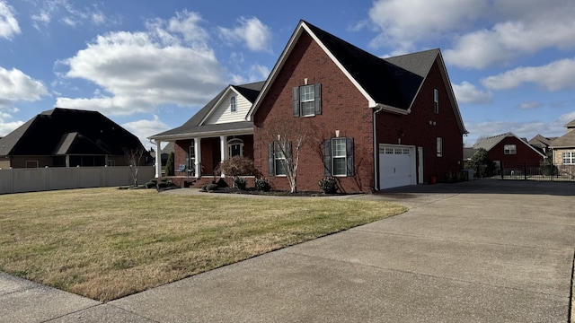 view of front of house featuring a front lawn, a porch, and a garage