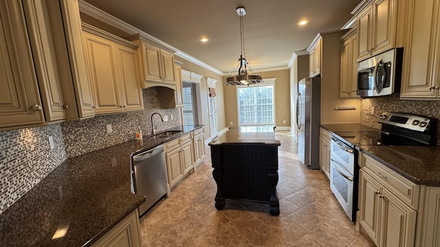 kitchen with a center island, sink, hanging light fixtures, stainless steel appliances, and dark stone countertops