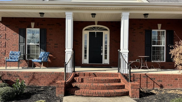 doorway to property with covered porch