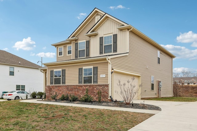 view of front of home featuring a front yard and a garage